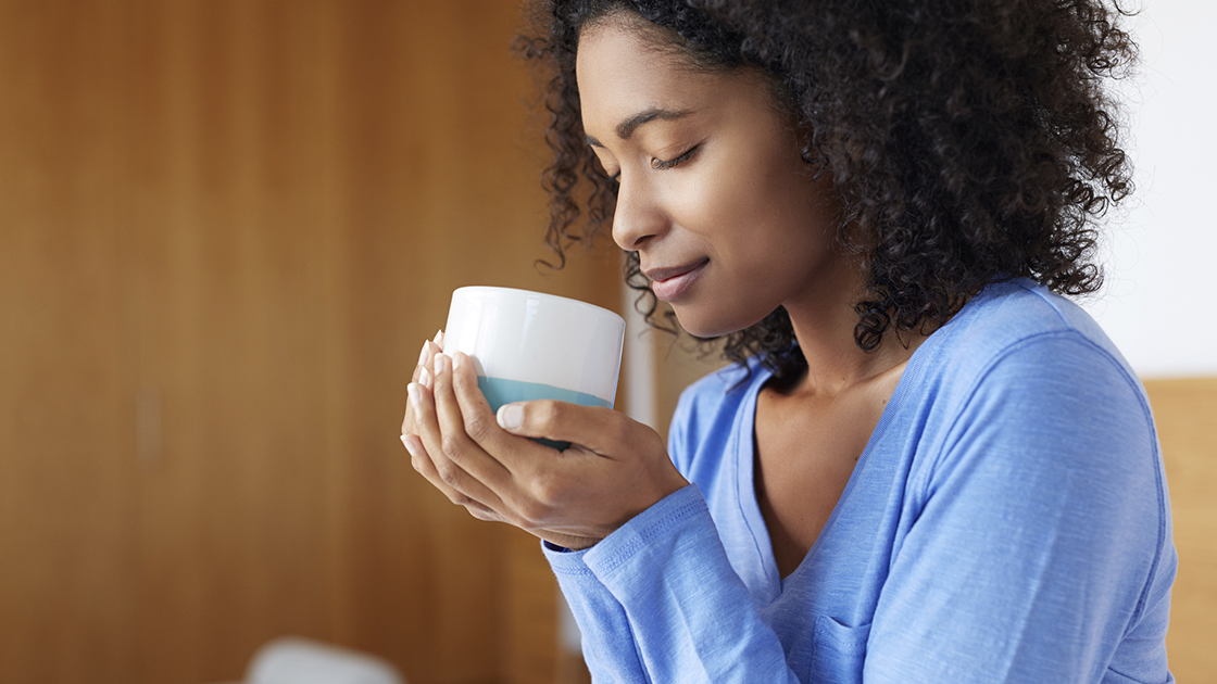 Woman holding a cup of tea